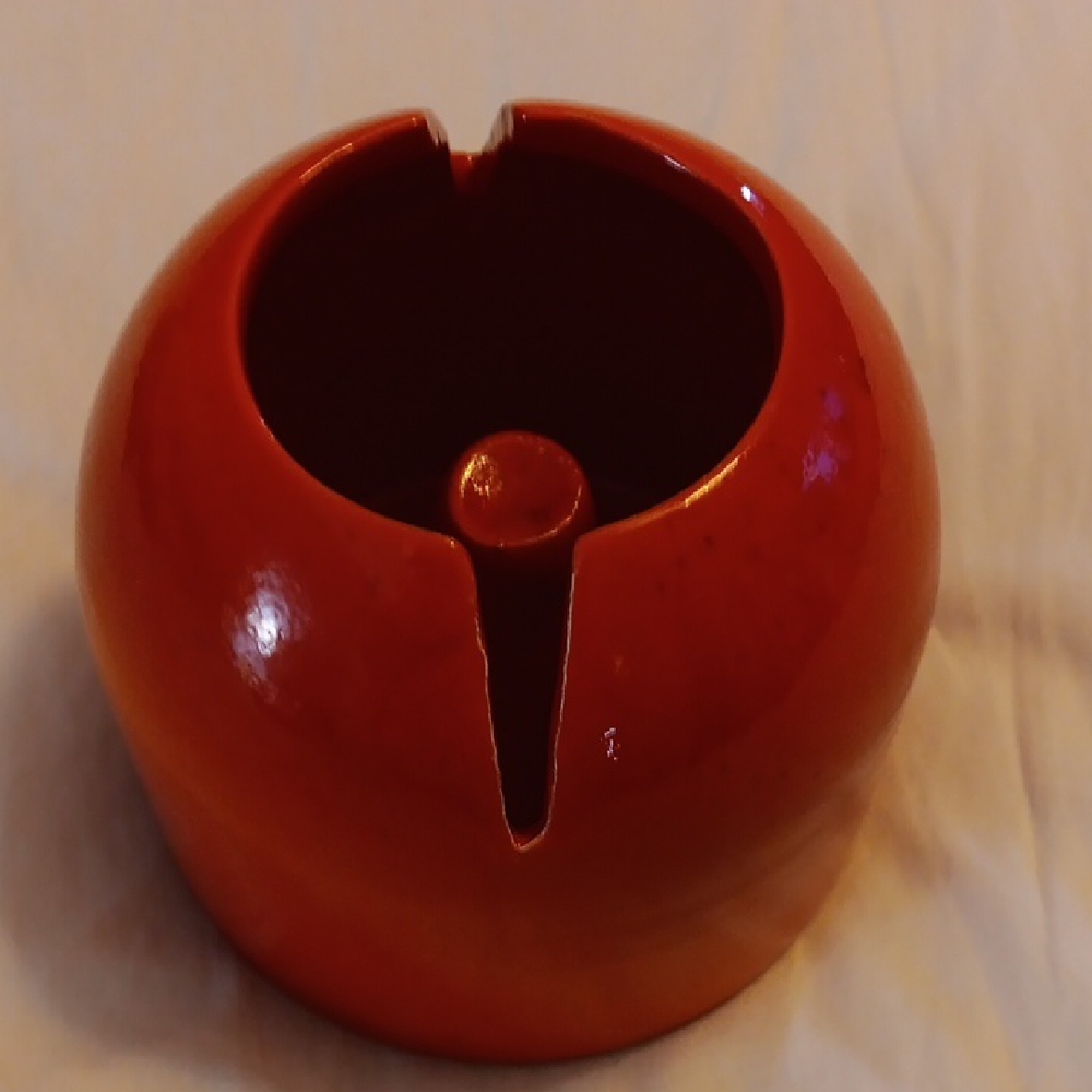 Red Ceramic Vessel with Glossy Finish and Unique Design
